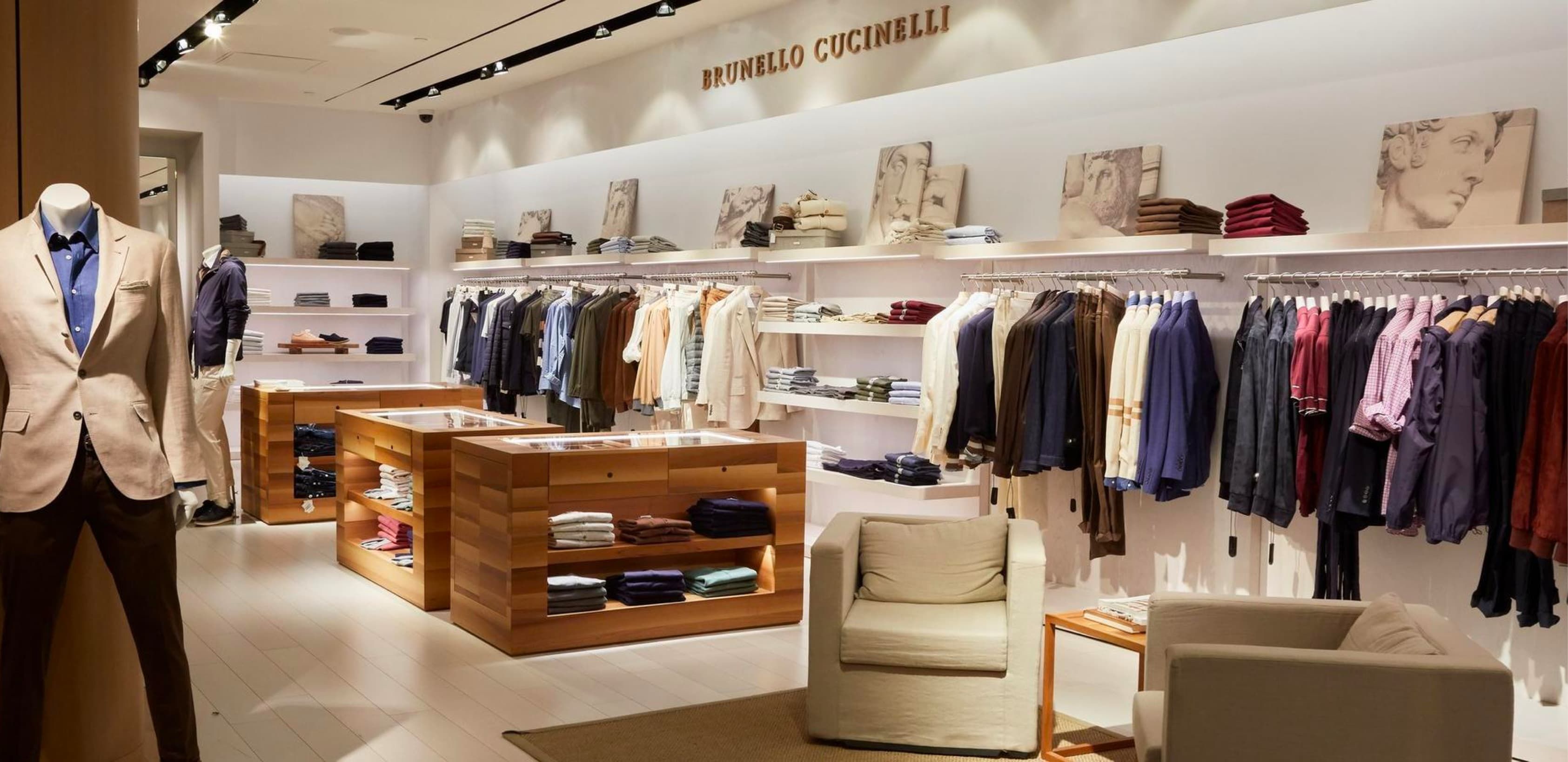 Inside a Harry Rosen retail store. The wall features designer clothes from Bruno Cucinelli.